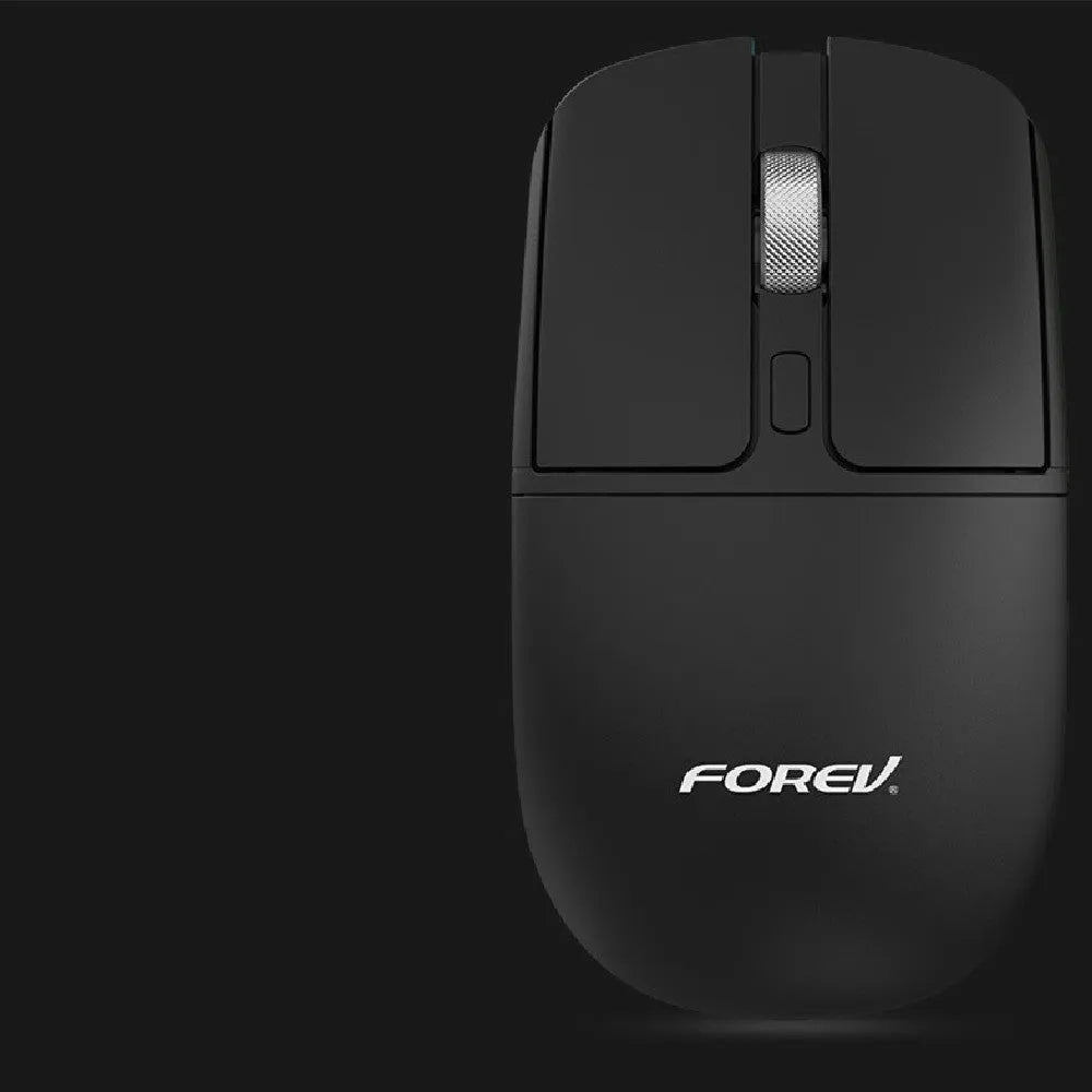 Compact wireless Bluetooth mouse with wireless charging, shown in grey colour on a desk.