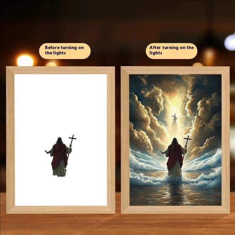 Modern rectangular light painting photo frame displaying an illuminated cross and scenic artwork.