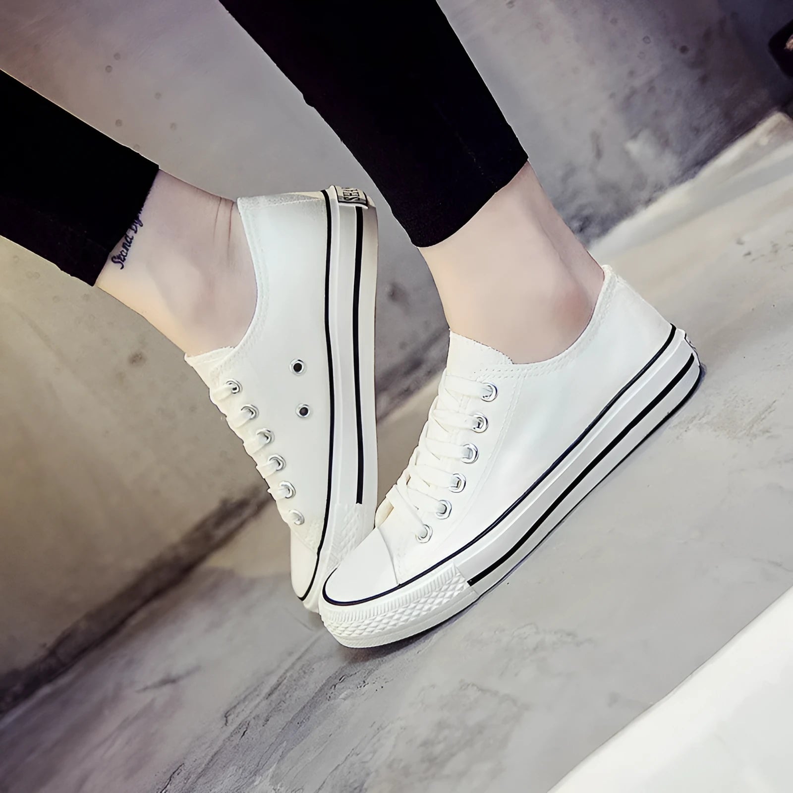 Women's solid-colour canvas casual shoes in black, shown from the side.
