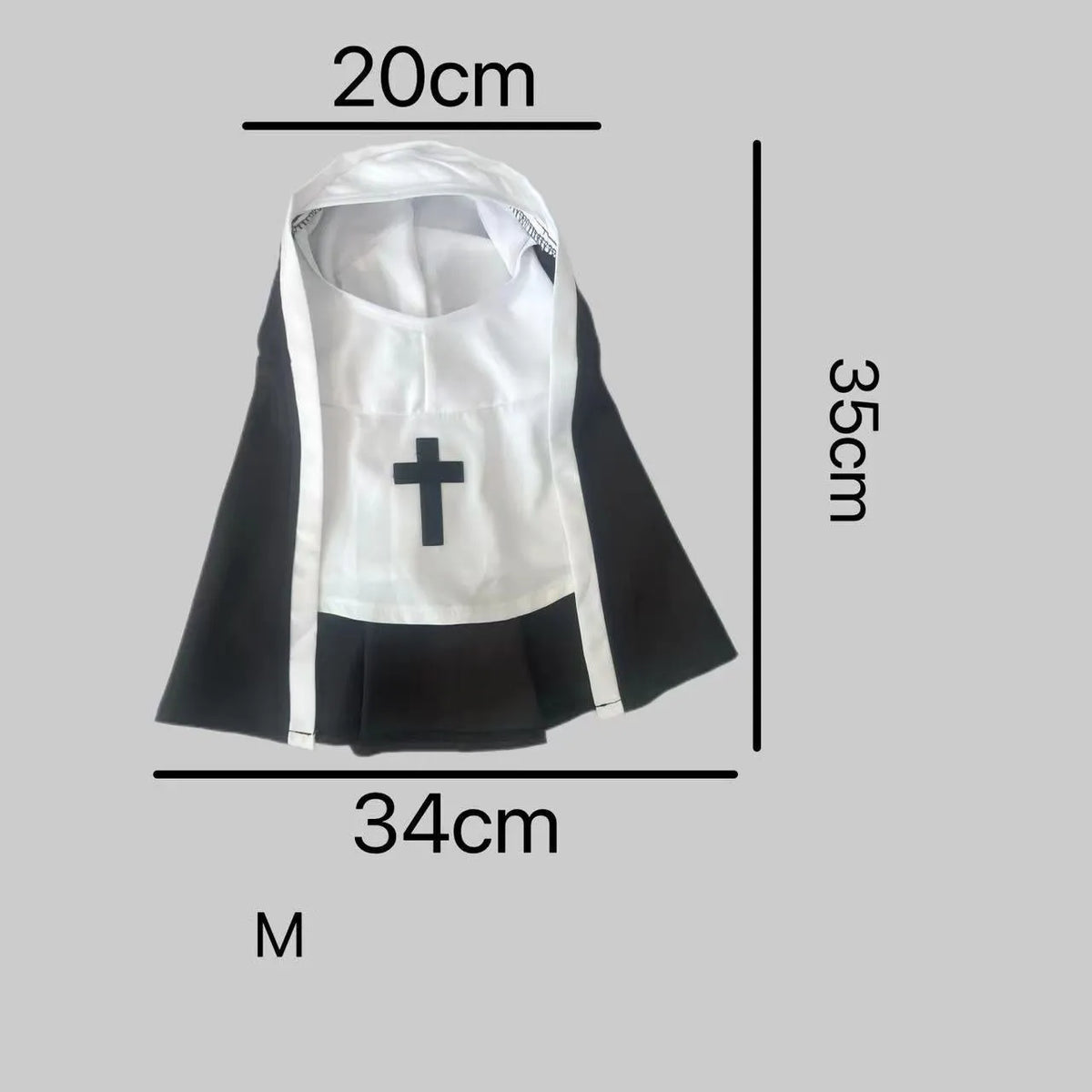 Black and white nun costume cloak for a small dog on a Halloween backdrop.