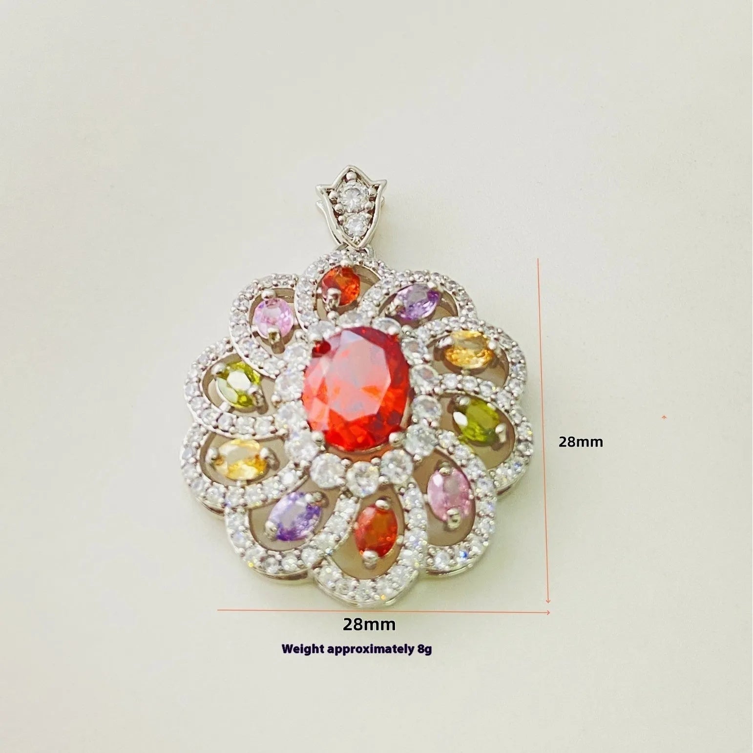 Close-up of a women's flower-shaped pendant necklace with a colourful zircon stone in a choice of gold, champagne gold, or platinum colour finishes.