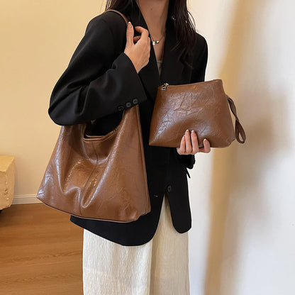 Classic vintage-inspired women's shoulder bag in a range of sophisticated colours, featuring a roomy interior, adjustable strap, and premium materials for timeless British style.