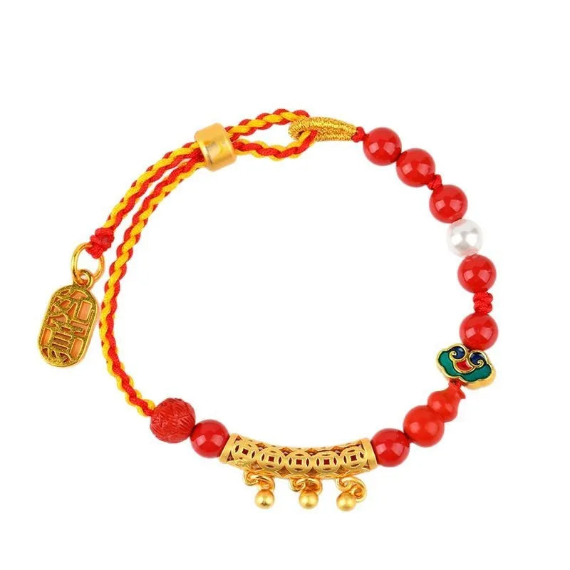 Women's hand-woven cinnabar bracelet with bell design in emperor red sand colour on red rope cord