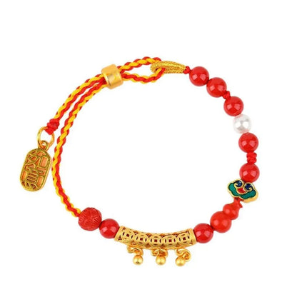 Women's hand-woven cinnabar bracelet with bell design in emperor red sand colour on red rope cord