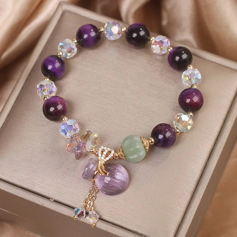 Women's crystal bracelet with purple tigereye money bag pendant and rhinestone decorations
