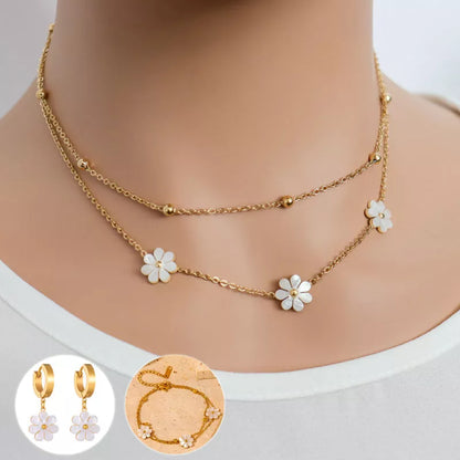 Stainless steel daisy flower jewellery set with necklace, bracelet, and earrings