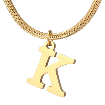 Elegant gold A-Z letter pendant necklace on a snake chain