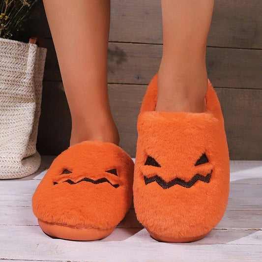 Cozy pumpkin-shaped slippers in orange color with plush fabric and non-slip sole for comfortable indoor wear