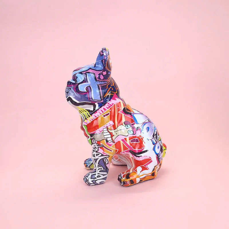 Colourful graffiti-style French bulldog resin statue on a white background