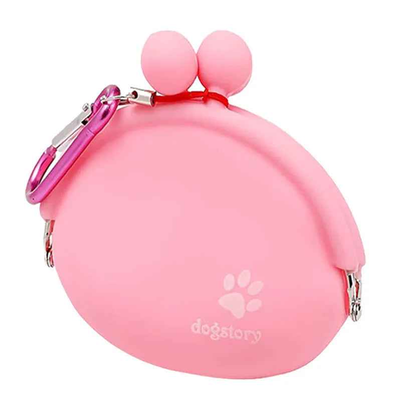 Yellow silicone dog training treat pouch with hook and loop closure, shown on a waistband.