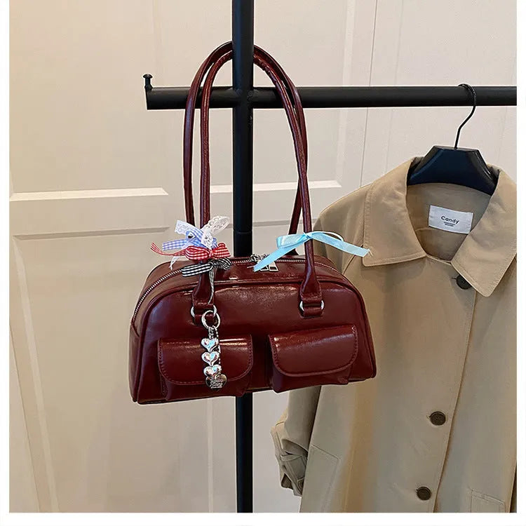 Women's retro pillow-shaped handbag in PU leather with double shoulder straps and flap closure