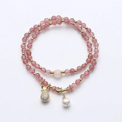 Geometric strawberry quartz crystal bracelet for women on a white background.