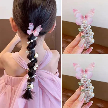 Colourful butterfly and pearl elastic hair band for children on a white background.