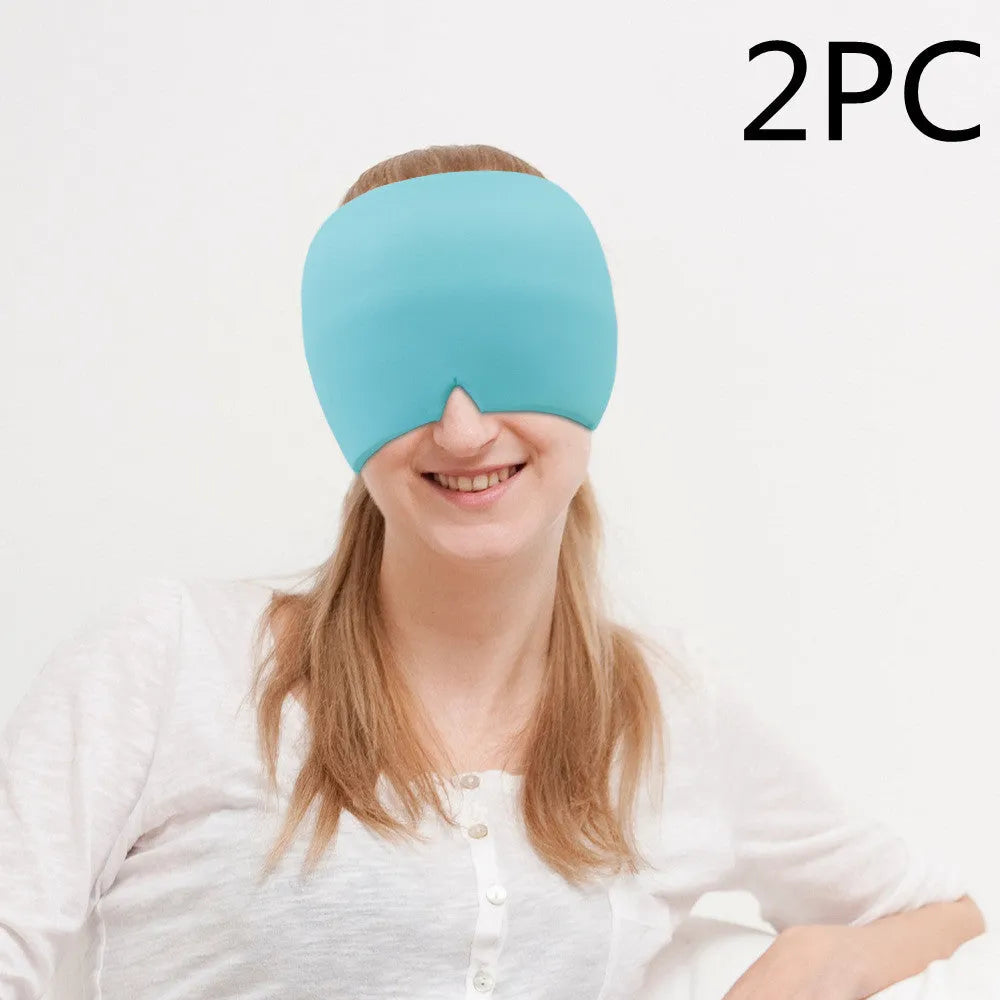 Black elastic cloth gel cold compress eye mask for headache relief on a grey background.