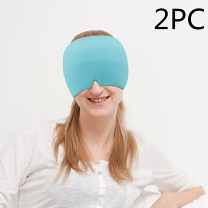 Black elastic cloth gel cold compress eye mask for headache relief on a grey background.