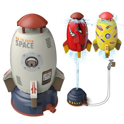 Yellow outdoor water pressure rocket launcher toy for kids on a green lawn.