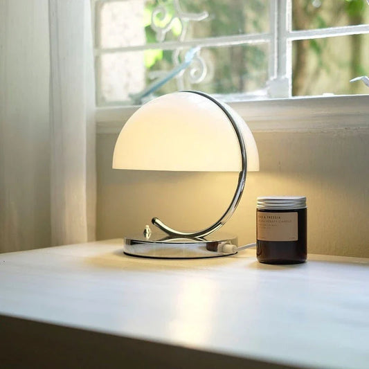 Retro-inspired table lamp with adjustable lighting modes, sleek minimalist design, and energy-efficient LED technology