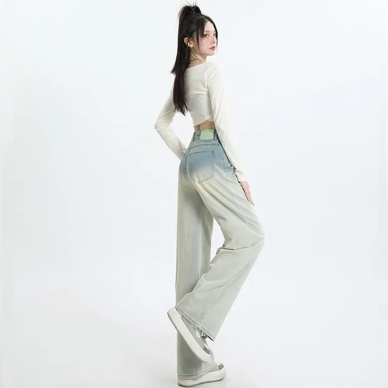 Women's gradient blue denim straight-leg trousers with 100% cotton fabric, showing colour transition and straight-leg silhouette