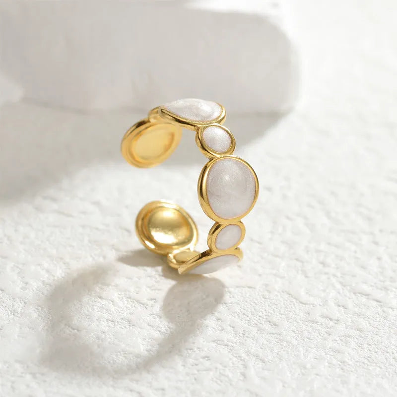 Adjustable geometric stainless steel ring showing angular design and opening mechanism