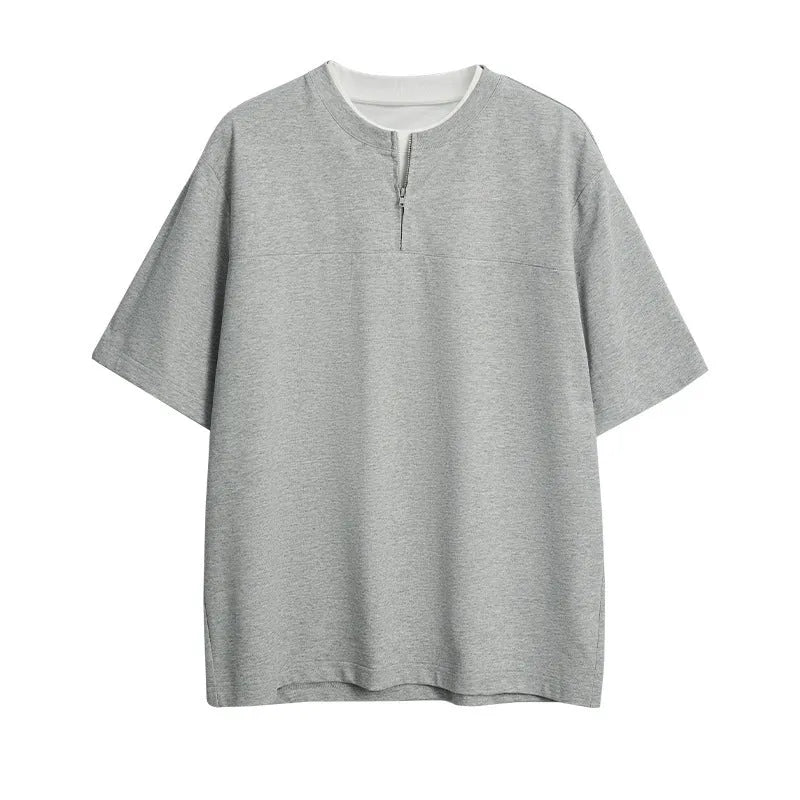 Solid colour loose fit cotton blend pullover top with patchwork collage detailing on a model.