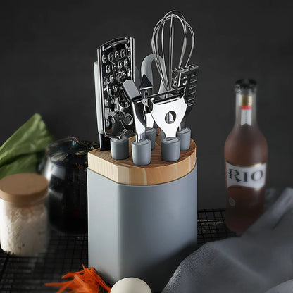 6-piece grey stainless steel kitchen utensil set with whisk, peeler, scissors on white background, essential for quick prep