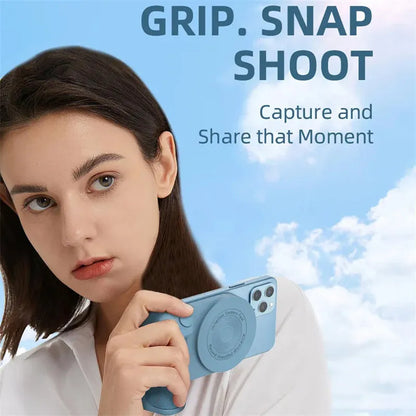 Black magnetic phone camera grip with rotatable bracket and ergonomic PU leather handle on a table.