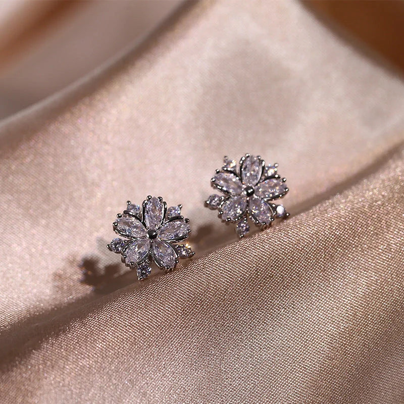 Dazzling cubic zirconia jewellery set with double-layered flower design, including ring, necklace, and earrings in pink and white diamond colours