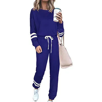 Women's loose-fitting plus size casual suit in a cotton blend, shown in a solid colour with a half-sleeve top and trousers.