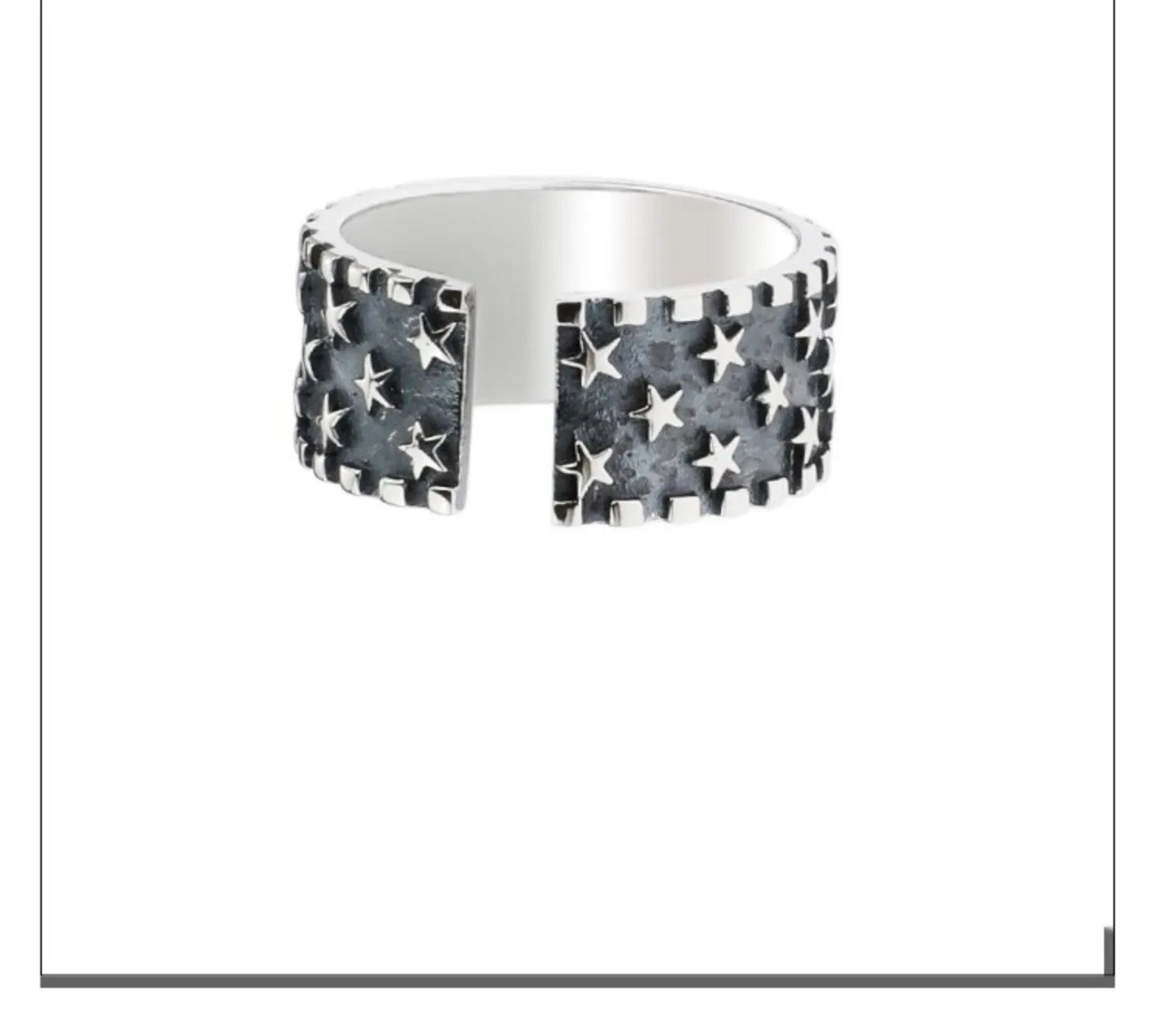 Adjustable sterling silver ring with a geometric pattern of multiple five-pointed stars on a polished band.