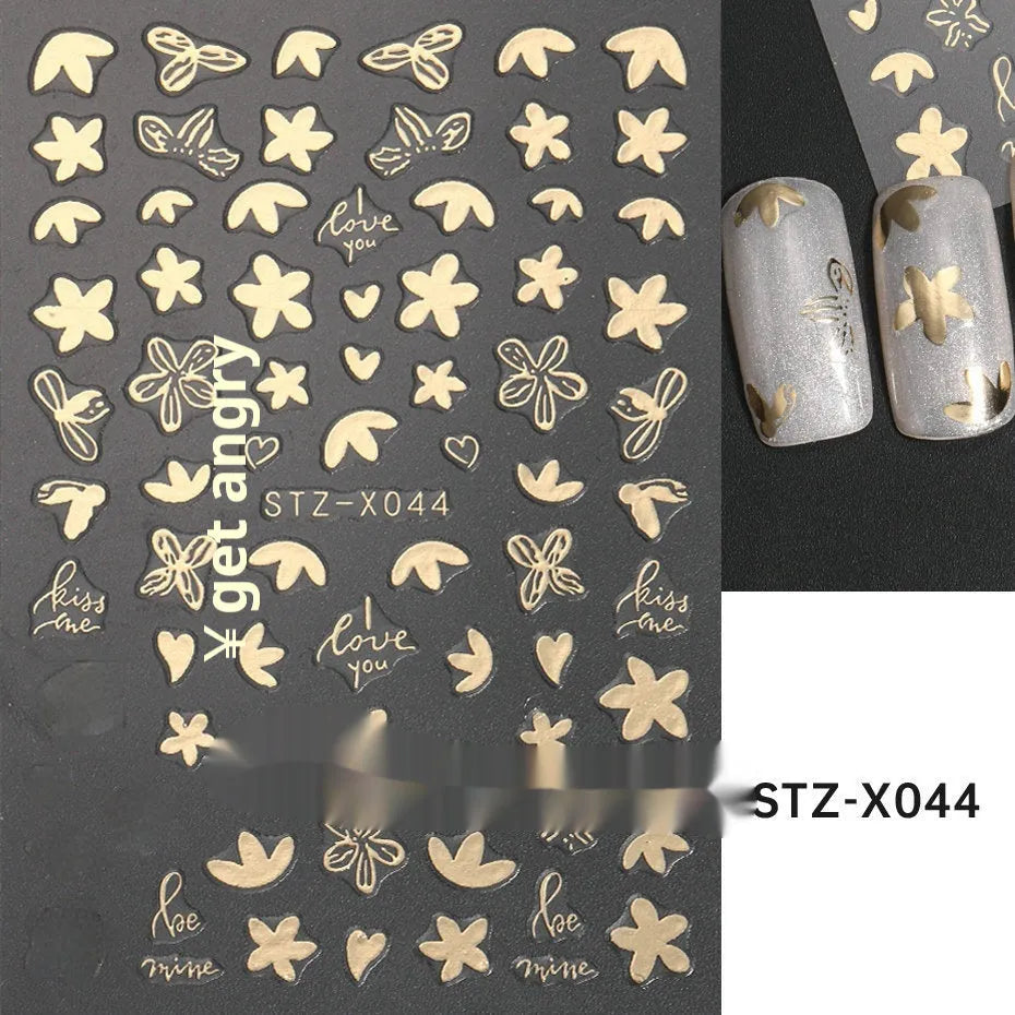 Assortment of black and silver nail sticker designs including cartoon and French tip patterns on a plastic sheet.