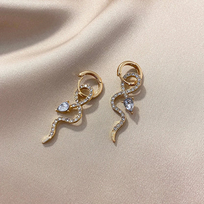 Elegant gold snake dangle earrings with a captivating serpentine design