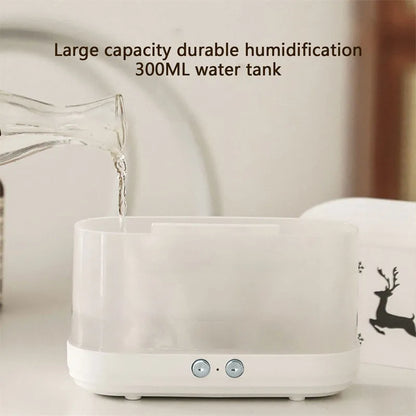 White round Elk flame effect humidifier and essential oil diffuser on a surface with mist and light on.