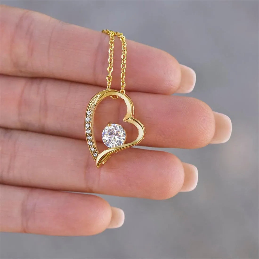 Heart-shaped necklace with hollow pendant in European and American style, showing silver or gold finish options