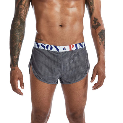 Men's solid colour breathable mesh boxer briefs on a mid waist, showing the fabric texture.