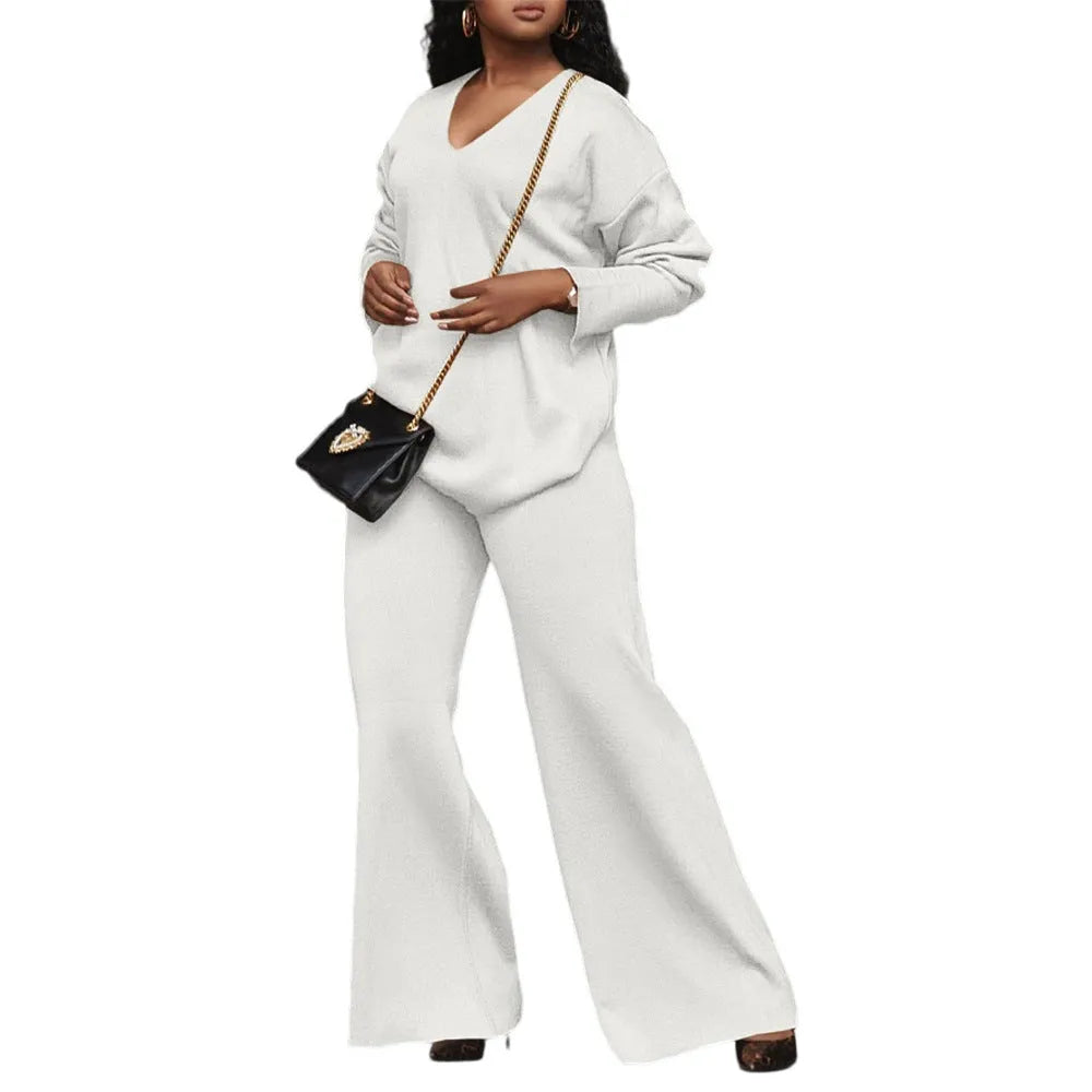 Women's brown suede two-piece suit with split sleeves on top and matching trousers