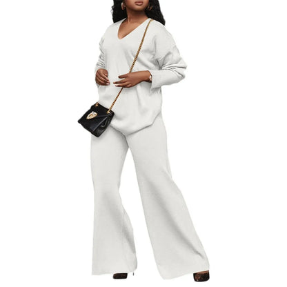 Women's brown suede two-piece suit with split sleeves on top and matching trousers