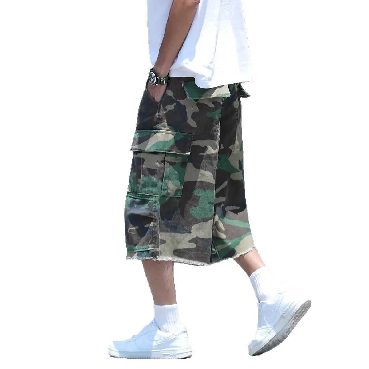 Man wearing loose-fit cropped camouflage shorts in a retro workwear style.