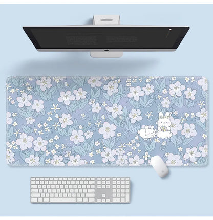 Large cartoon flower pattern mouse pad with non-slip rubber base on desk