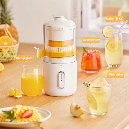 Fresh green portable USB electric juicer and blender for oranges and vegetables on a kitchen counter.
