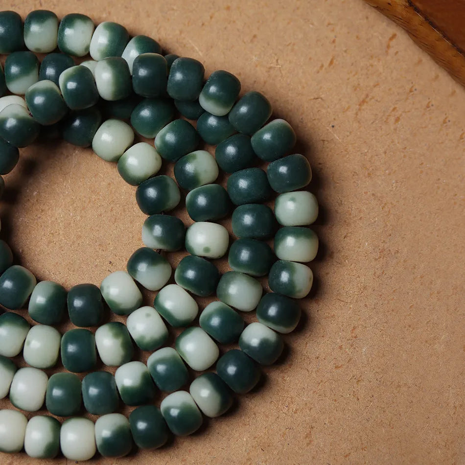 Lotus white jade Bodhi root bracelet with floating flowers pattern on 8x10mm beads