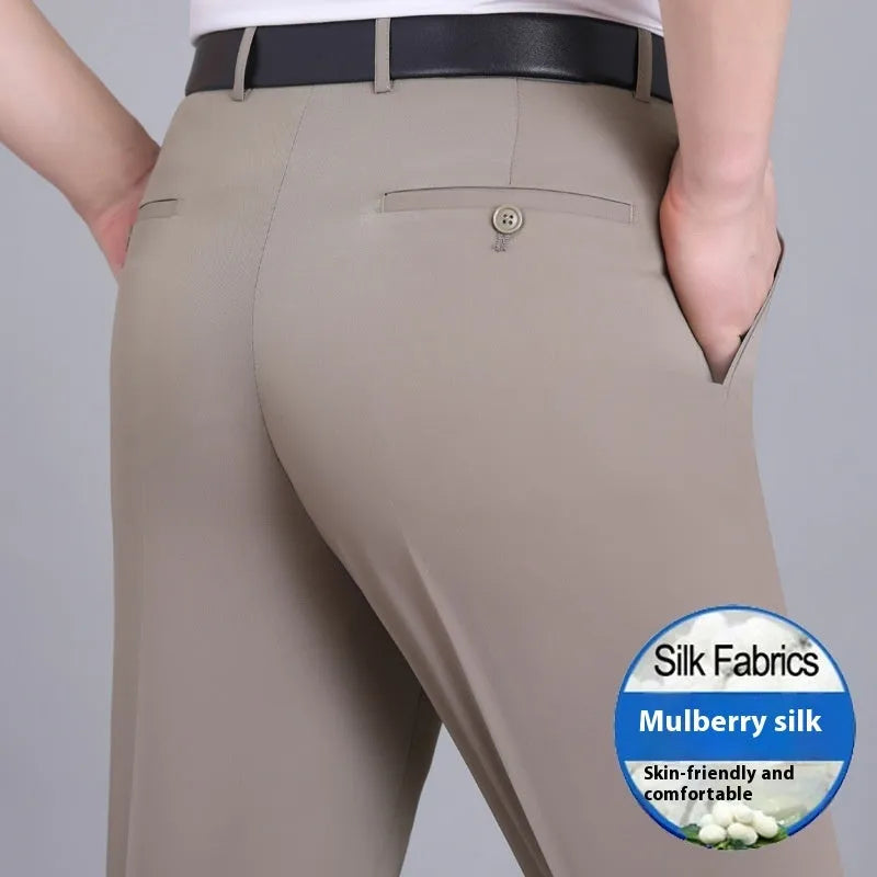 Man wearing dark blue straight-leg non-iron business trousers with a mulberry silk blend fabric.