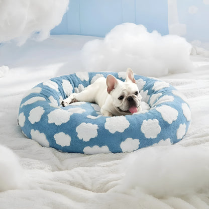 Round blue and white plaid dog bed with plastic sides on wooden floor