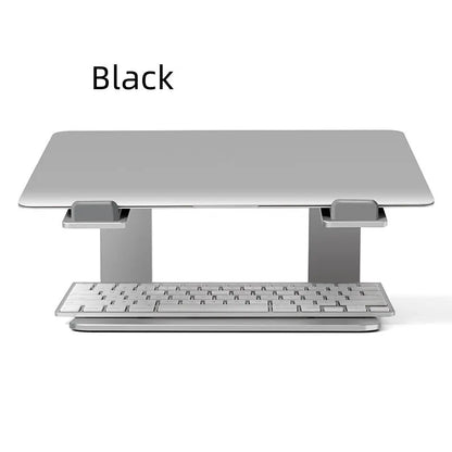 Black aluminium alloy laptop stand on a desk, showing its raised platform and open base design.