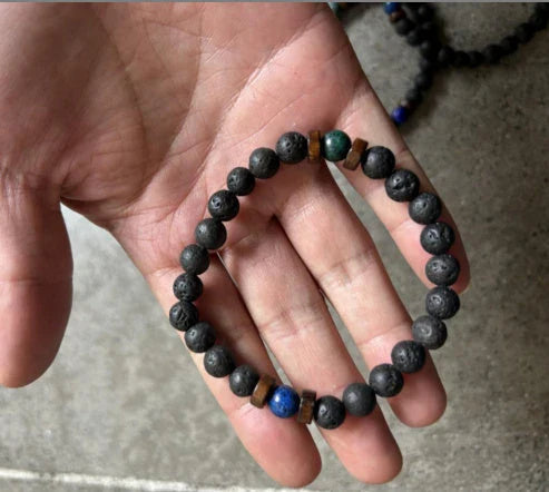 A stylish and durable men's bracelet made with volcanic stone, flash stone, and wood chips
