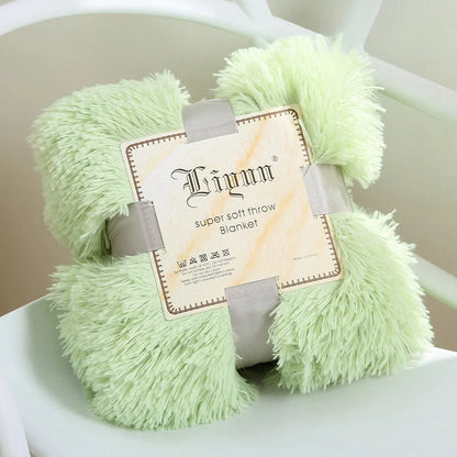 Soft coral fleece blanket in various colours and sizes for home and travel comfort