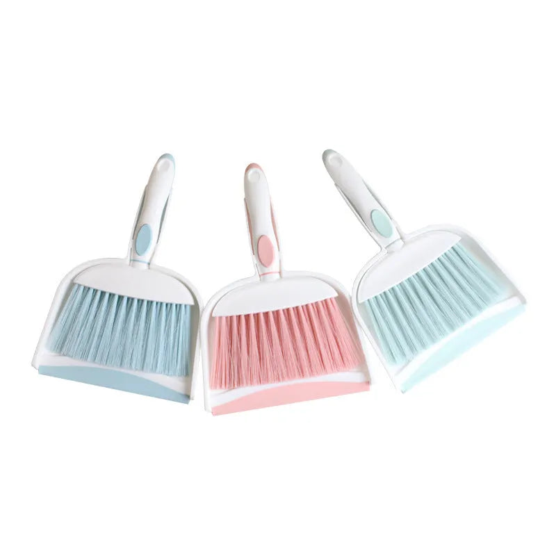 Small plastic handheld dustpan and brush cleaning kit in assorted colours.