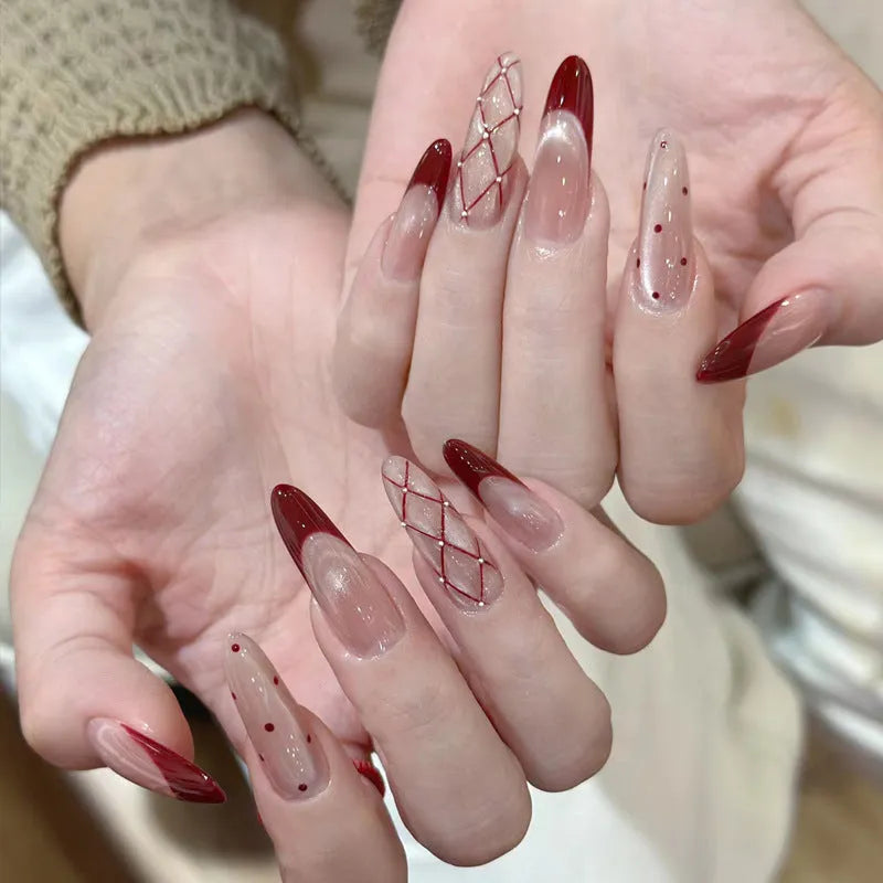 Five packs of reusable coloured false fingernails with various designs.