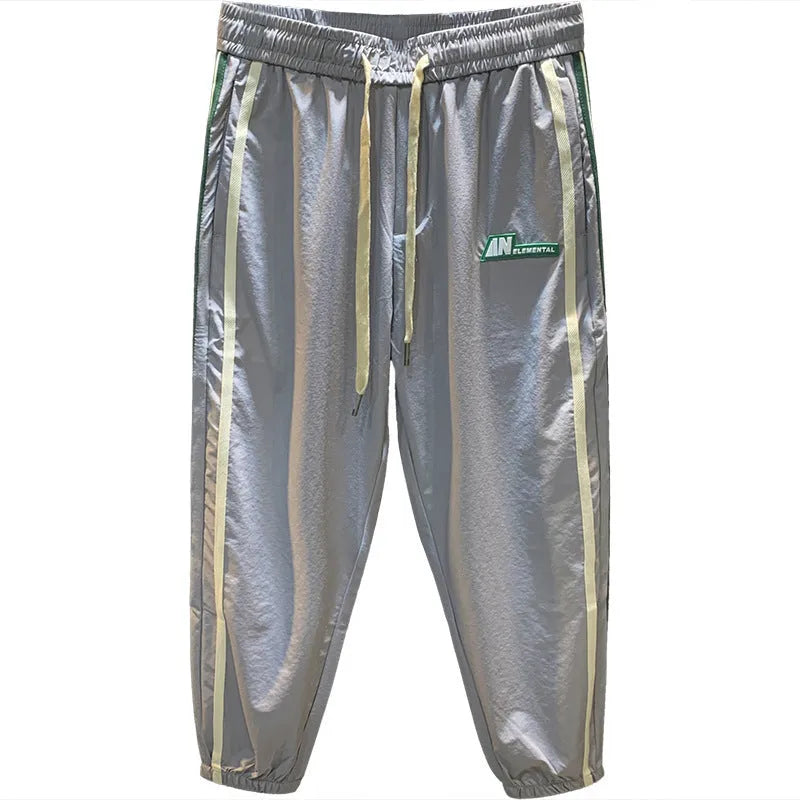 Men's grey cotton blend harem pants with elastic waistband and loose leg design