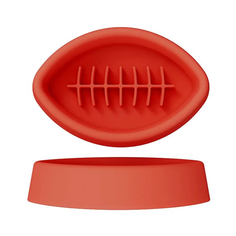 Blue silicone pet slow feeder bowl with textured interior and a white suction cup base on a wooden floor.