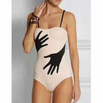 Women's one-piece bikini swimsuit with gauze skirt cover-up on beach